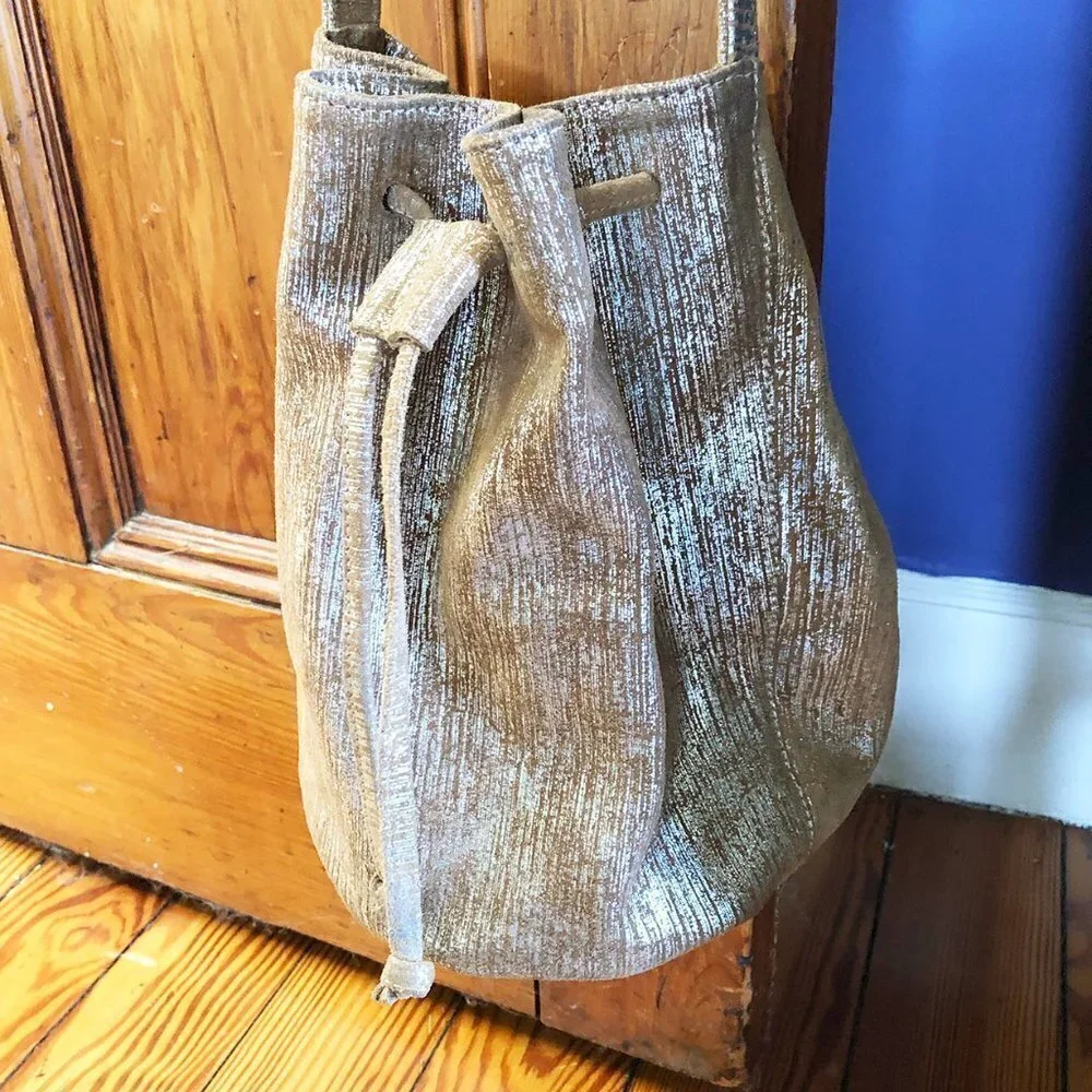 Marie Turnor Neutral Metallic Textured Drawstring Bucket Bag